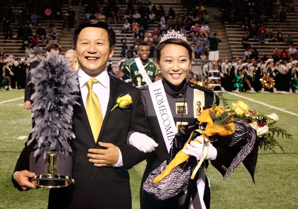 Lani Nguyen leaves the band during the homecoming game;s halftime to claim her crown.