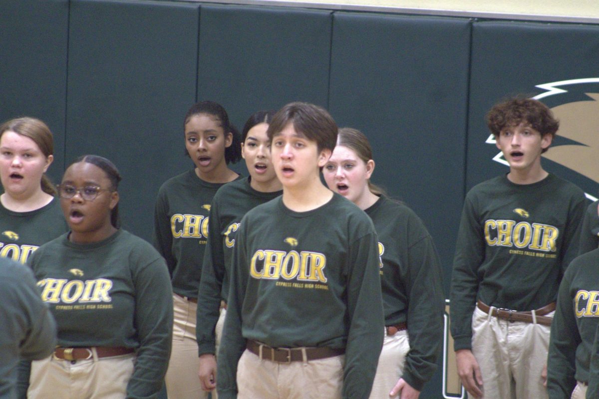 Alexander Mandi performing for Veterans' Day in the Cypress Falls' gymnasium. 






